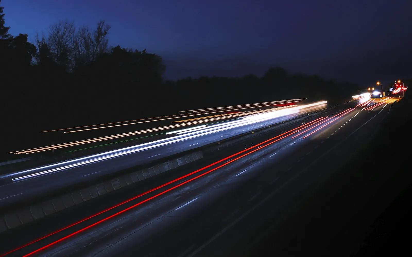 Light trails from traffic on a highway at night