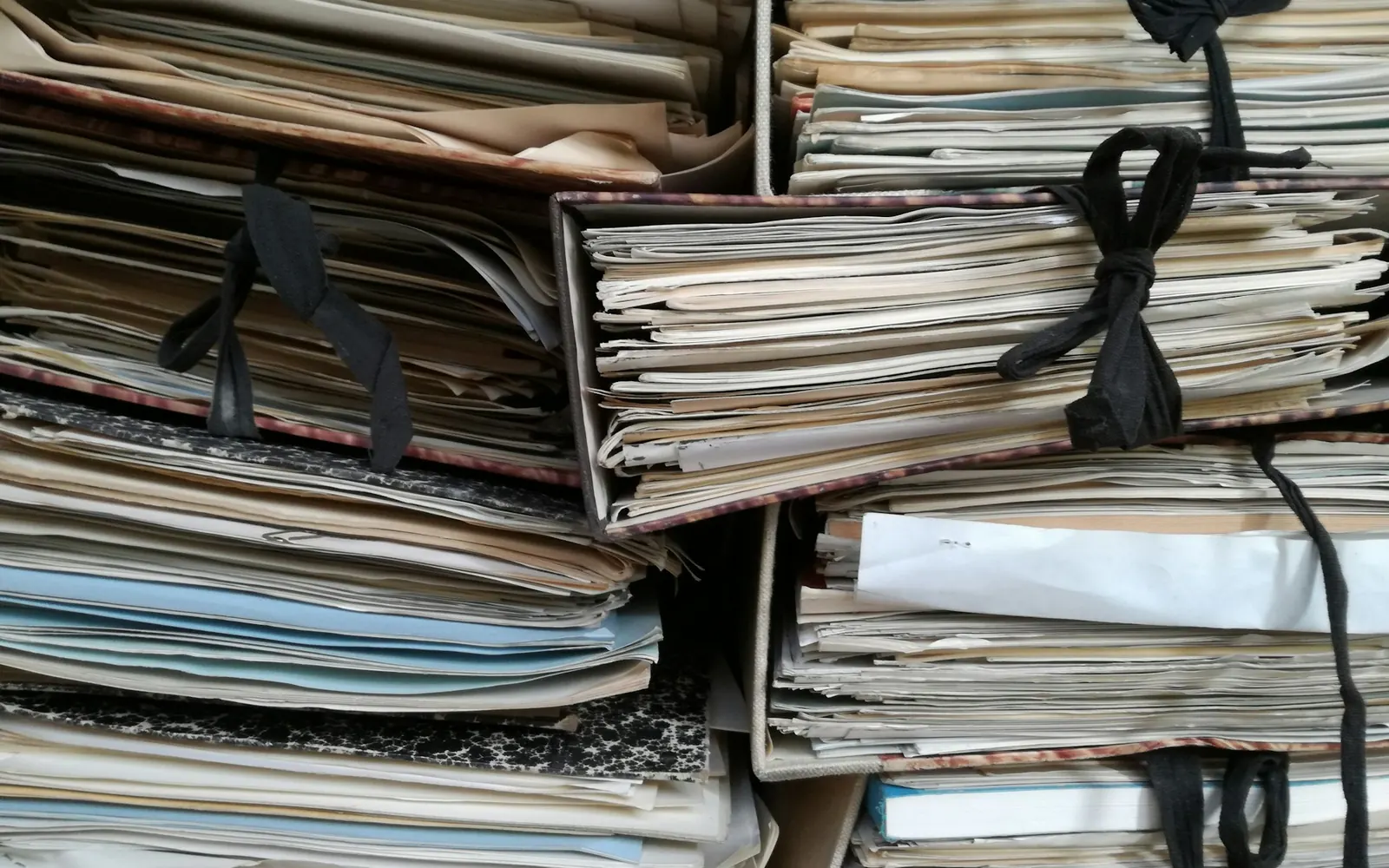 Stacks of bundled paper files
