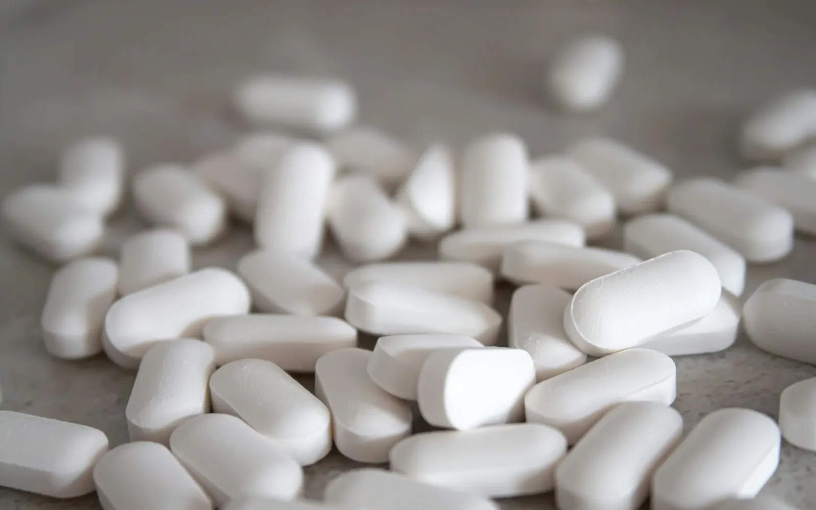 Close-up of white tablets on a table